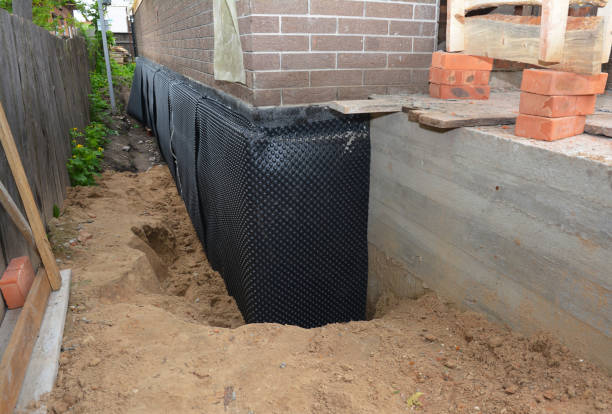 Happy homeowners after waterproofing job in East Setauket